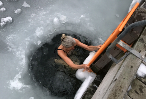 Woman bathing in ice water