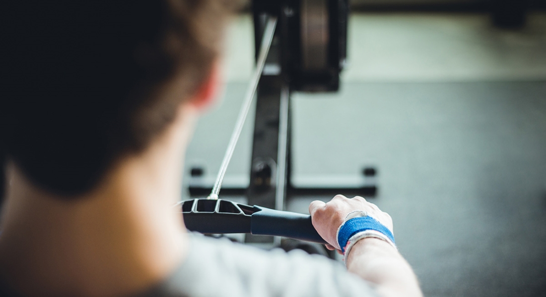 A person using a rowing machine