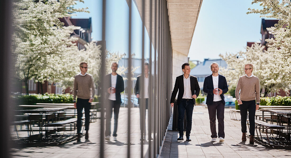 Photo of the three founders of spinout company Ousia Pharma outside of the BII building Photo of the three founders of spinout company Ousia Pharma outside of the BII building