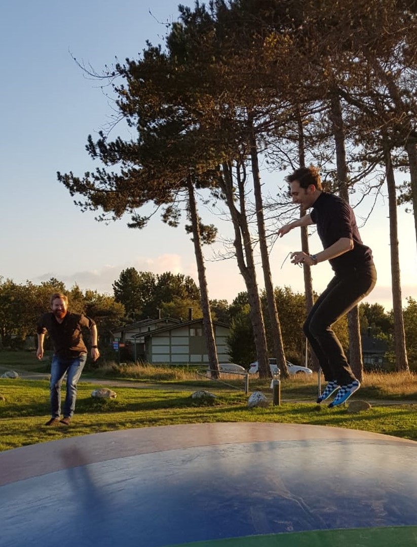 Group members on a trampoline